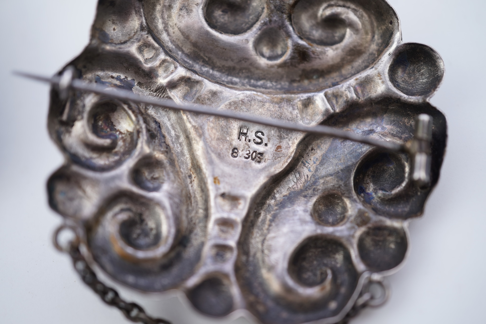 Two Arts & Crafts silver and amber pendant brooches, probably Denmark, early 20th century